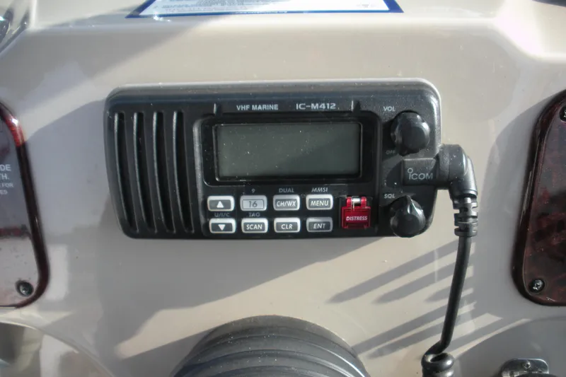 Slide: The Image of VHF marine radio on 2006 Sea Ray 260 Sundancer boat dashboard. - 11