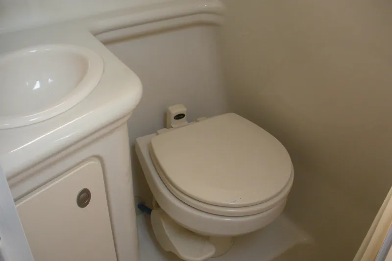 Slide: The Image of 2006 Sea Ray 260 Sundancer bathroom with sink and toilet. - 6