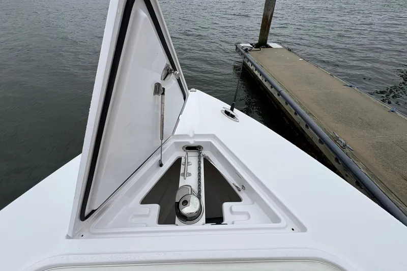 Slide: The Image of Open anchor hatch on 2023 Jupiter 30 boat at dockside. - 18