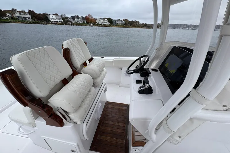 Slide: The Image of Luxurious 2023 Jupiter 30 boat interior with plush seating and advanced navigation system. - 24