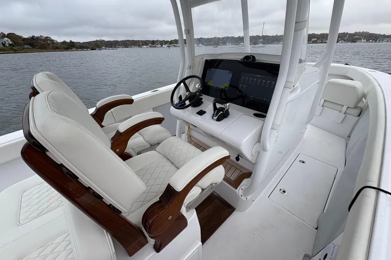 Slide: The Image of Interior of 2023 Jupiter 30 boat with luxurious seating and advanced navigation system. - 27