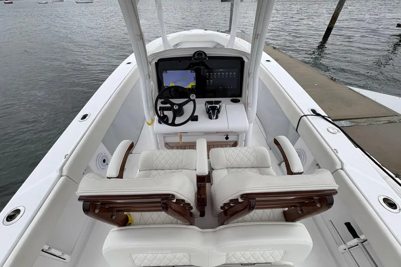 Slide: The Image of 2023 Jupiter 30 boat interior with modern helm and luxurious seating. - 28