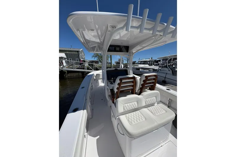 Slide: The Image of 2023 Jupiter 30 boat interior with sleek seating and modern helm design. - 59
