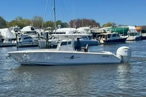 Slide: The Image of 2023 Jupiter 30 boat interior with white seating and helm station. - 71