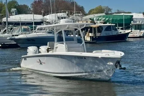 Slide: The Image of Helm of 2023 Jupiter 30 boat with steering wheel and navigation display. - 76