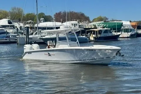 Slide: The Image of 2023 Jupiter 30 boat interior with white seating and helm station. - 83