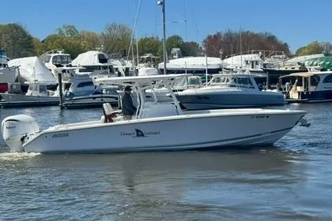 Slide: The Image of Control panel of a 2023 Jupiter 30 boat with modern throttle levers. - 93