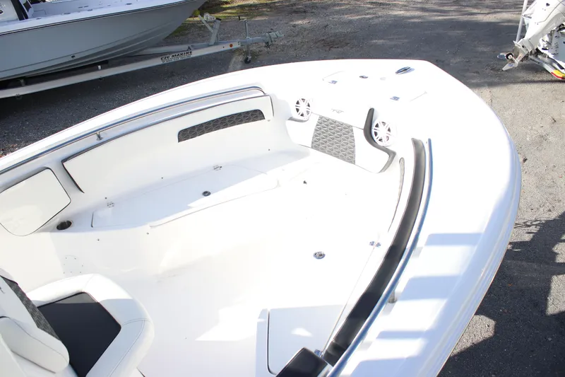 Slide: The Image of 2026 Tidewater 220 CC Adventure boat interior with seating and speakers. - 10