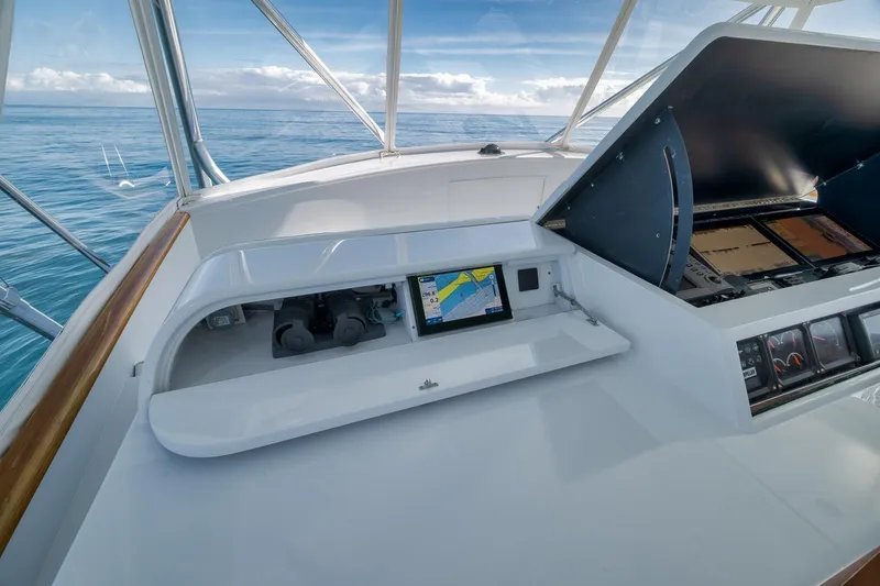 Slide: The Image of 1998 Rybovich Convertible yacht dashboard with navigation screens, open sea view. - 19
