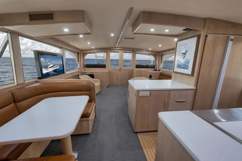 Slide: The Image of Luxurious interior of a 1998 Rybovich Convertible yacht with modern amenities and ocean view. - 5