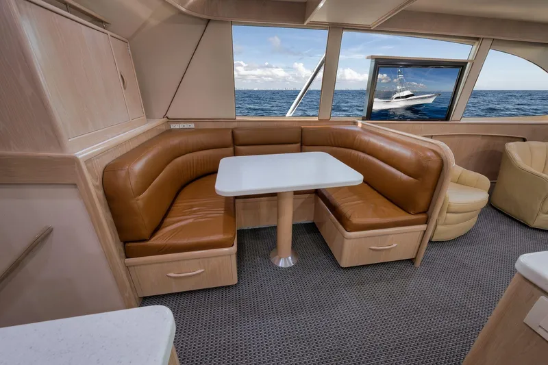 Slide: The Image of Interior of 1998 Rybovich Convertible yacht with leather seating and ocean view. - 7