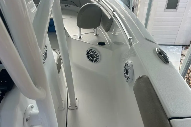 Slide: The Image of 2021 Sportsman Open 232 Center Console dashboard with dual Garmin displays and steering wheel. - 11