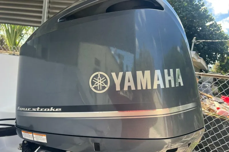 Slide: The Image of 2021 Sportsman Open 232 Center Console boat interior with seating and speaker. - 15