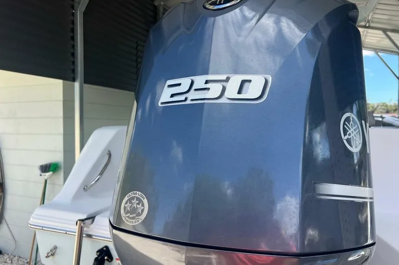 Slide: The Image of 2021 Sportsman Open 232 Center Console boat interior with seating and speakers. - 16