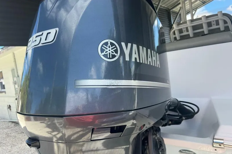 Slide: The Image of 2021 Sportsman Open 232 Center Console boat interior with cushioned seating. - 17