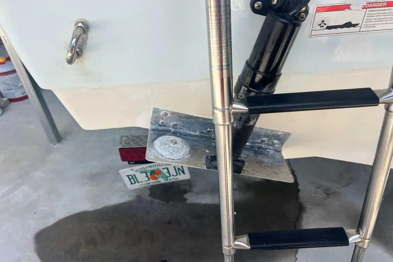 Slide: The Image of 2021 Sportsman Open 232 Center Console boat with Yamaha 250 engine, docked outdoors. - 18