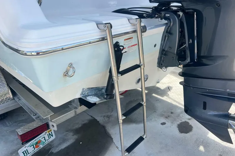 Slide: The Image of 2021 Sportsman Open 232 Center Console boat on trailer, underside view. - 25