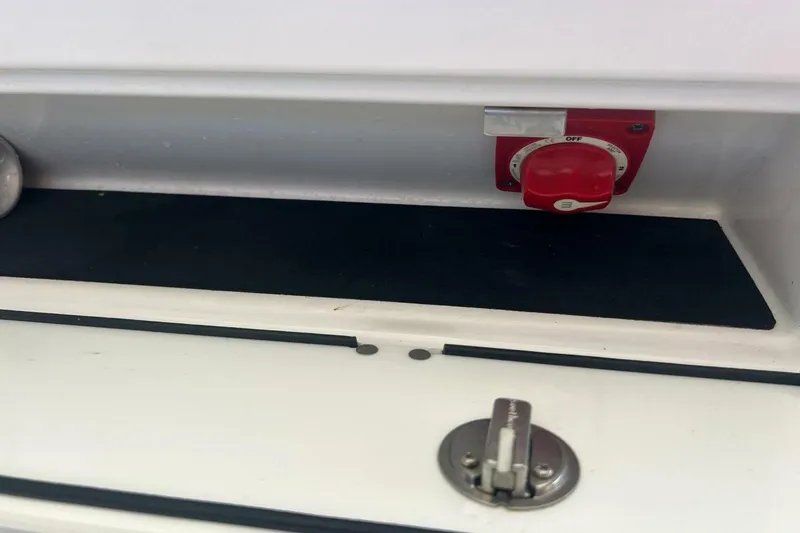 Slide: The Image of Close-up of 2021 Sportsman Open 232 Center Console boat detail with chrome trim. - 29