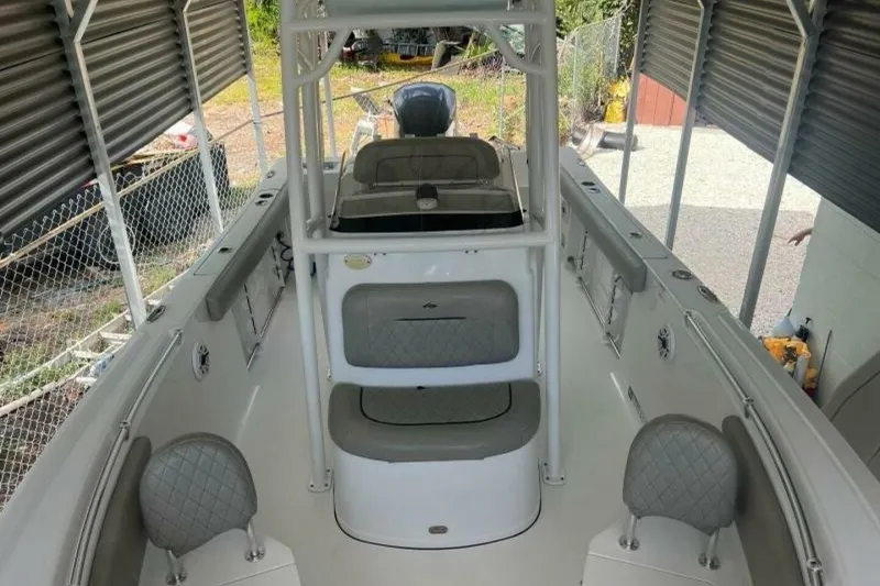 Slide: The Image of 2021 Sportsman Open 232 Center Console boat on trailer in driveway. - 3