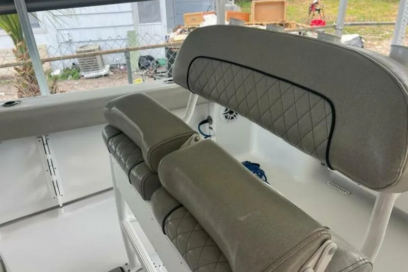 Slide: The Image of 2021 Sportsman Open 232 Center Console livewell with cushioned seating. - 32