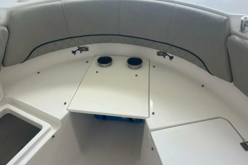 Slide: The Image of 2021 Sportsman Open 232 Center Console battery switch and compartment detail. - 34