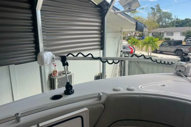 Slide: The Image of 2021 Sportsman Open 232 Center Console dashboard with Garmin displays and control switches. - 35