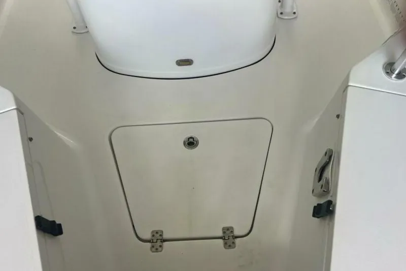 Slide: The Image of 2021 Sportsman Open 232 Center Console boat interior with cushioned seating. - 37