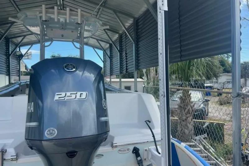 Slide: The Image of 2021 Sportsman Open 232 Center Console boat interior with seating and cup holders. - 39