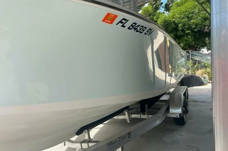 Slide: The Image of 2021 Sportsman Open 232 Center Console boat interior with livewell feature. - 43