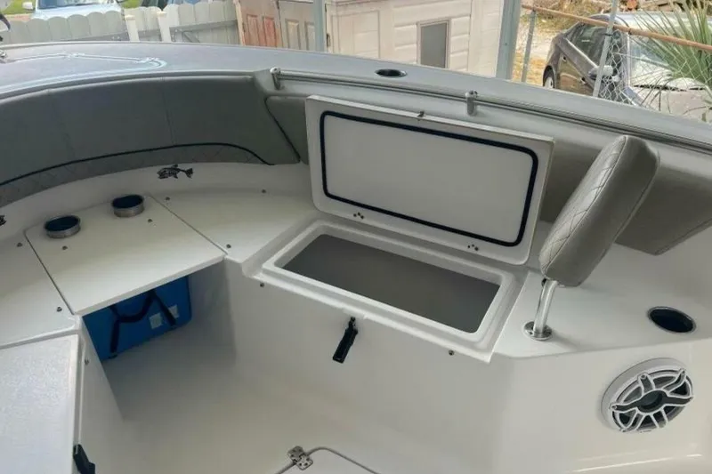 Slide: The Image of 2021 Sportsman Open 232 Center Console T-top with rod holders and speakers. - 9
