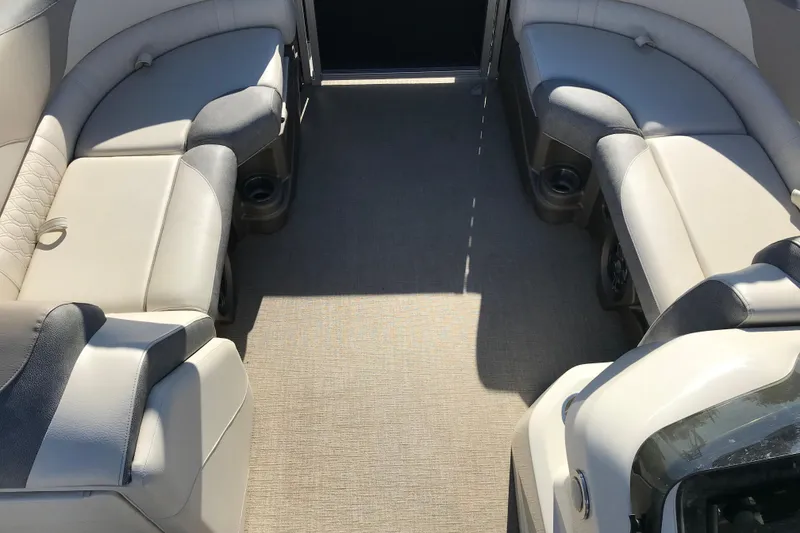 Slide: The Image of 2023 Avalon LSZ Rear Fish boat interior with plush seating and cup holders. - 12