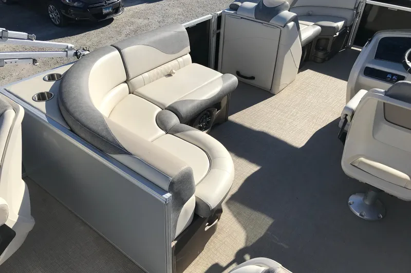 Slide: The Image of 2023 Avalon LSZ Rear Fish boat interior with plush seating and cup holders. - 19
