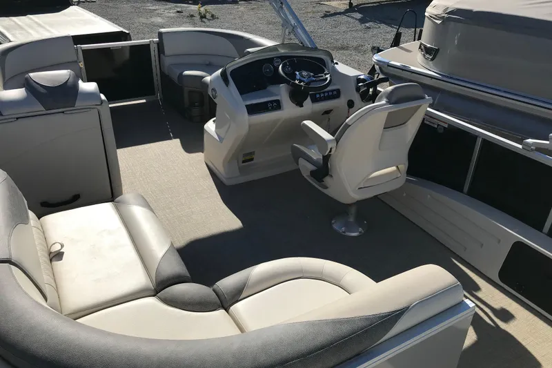 Slide: The Image of 2023 Avalon LSZ Rear Fish boat interior with seating and steering console. - 20