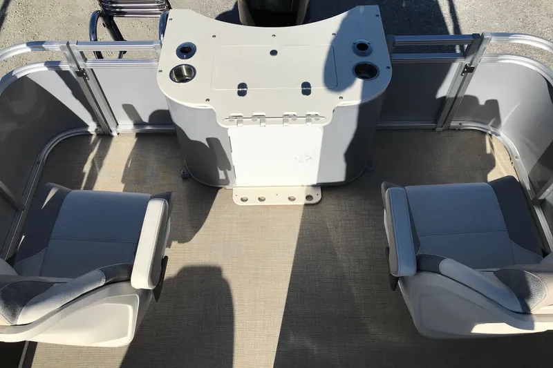 Slide: The Image of 2023 Avalon LSZ Rear Fish boat interior with two seats and a control panel. - 21