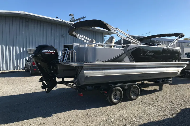 Slide: The Image of 2023 Avalon LSZ Rear Fish pontoon boat with Mercury engine on trailer. - 3