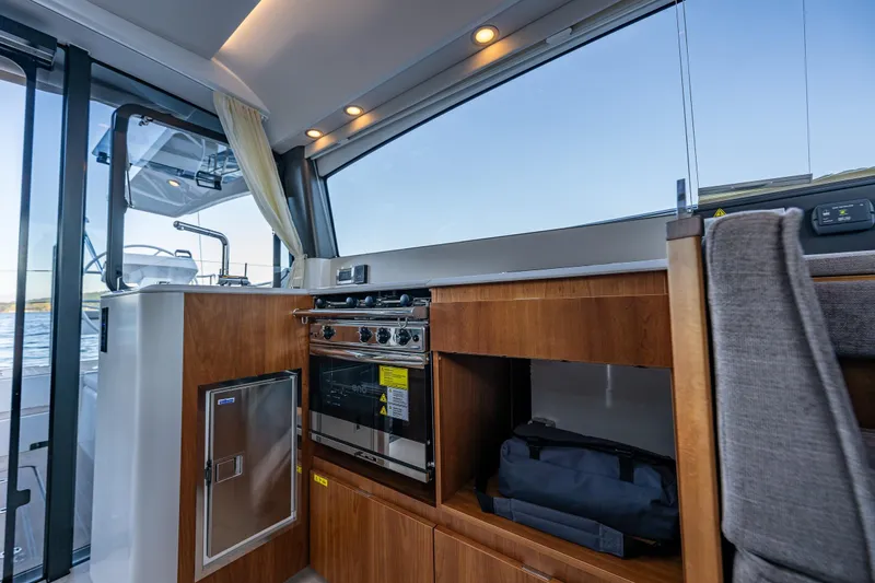 Slide: The Image of Modern kitchen interior on 2024 Moody 41ds yacht with wood cabinetry and stainless appliances. - 17