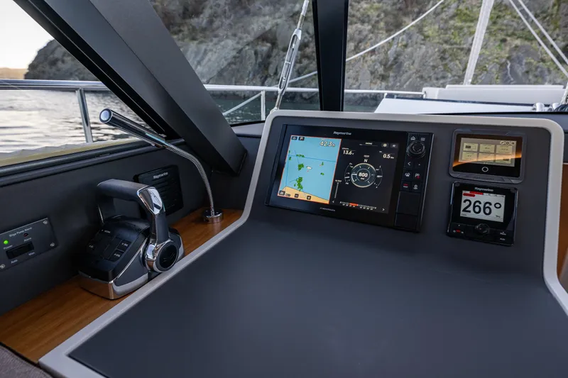 Slide: The Image of 2024 Moody 41ds yacht cockpit with advanced navigation system and controls. - 19