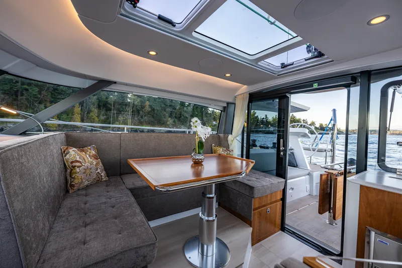 Slide: The Image of Luxurious interior of 2024 Moody 41DS yacht with elegant seating and panoramic windows. - 21