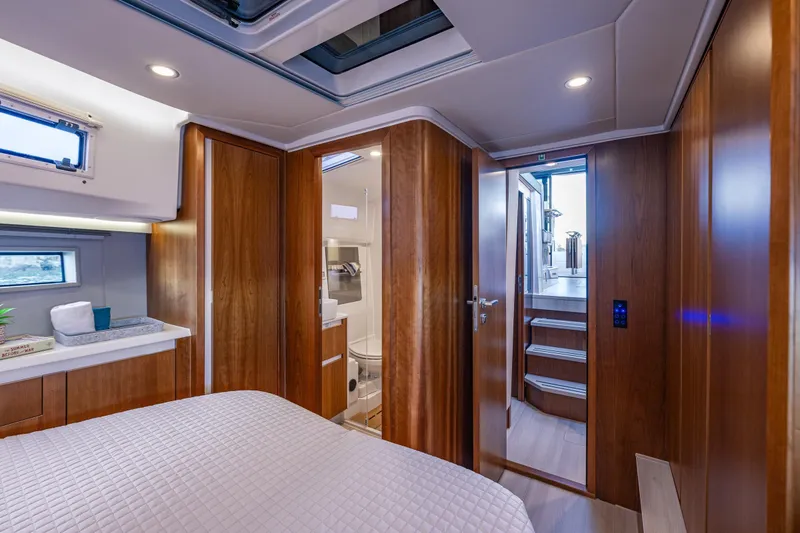 Slide: The Image of Luxurious 2024 Moody 41ds yacht interior with wood paneling and modern amenities. - 23
