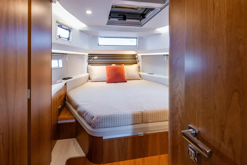 Slide: The Image of Luxurious cabin interior of 2024 Moody 41ds yacht with cozy bed and wooden finish. - 24