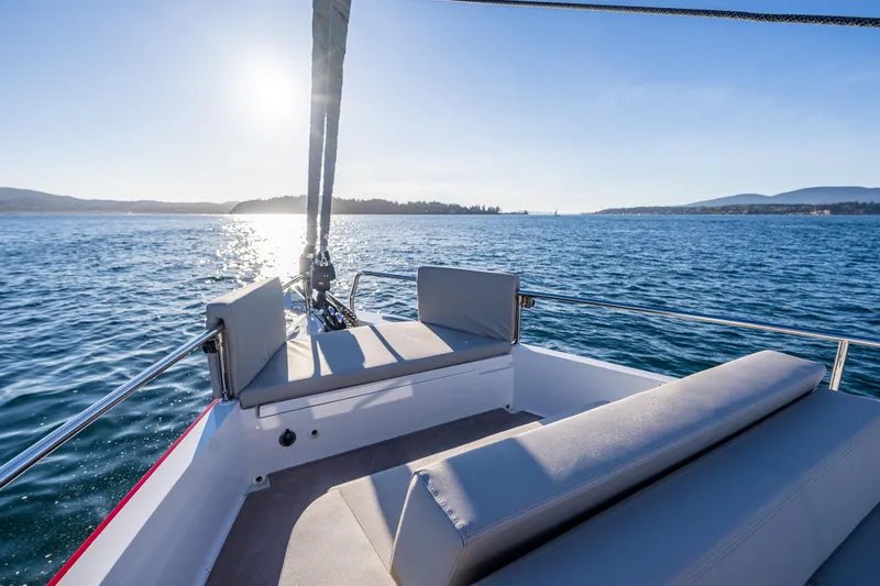 Slide: The Image of 2024 Moody 41ds sailboat deck with ocean view and sunlight. - 32
