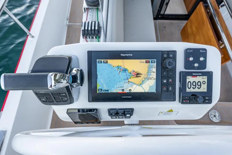 Slide: The Image of Control panel of 2024 Moody 41ds yacht with navigation display and throttle. - 33