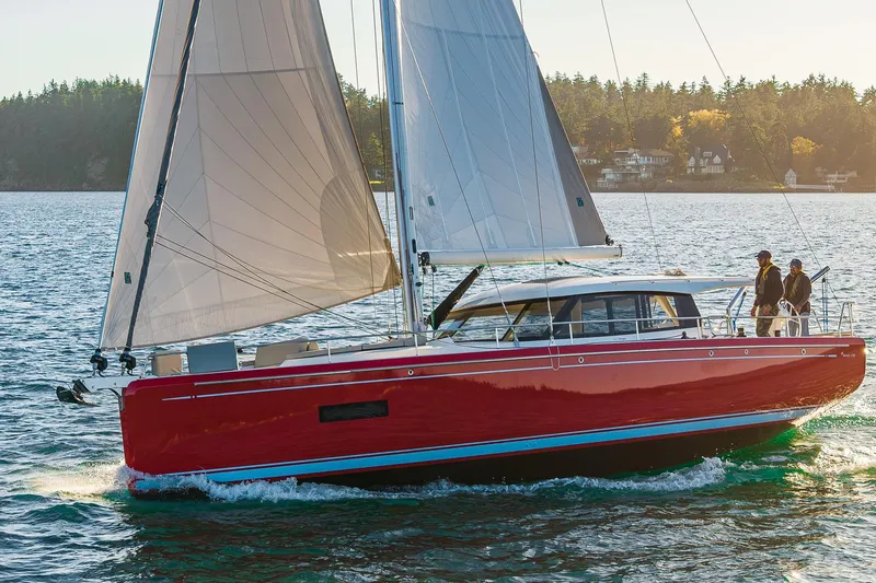 Slide: The Image of 2024 Moody 41ds sailboat with red hull sailing on a sunny day. - 5