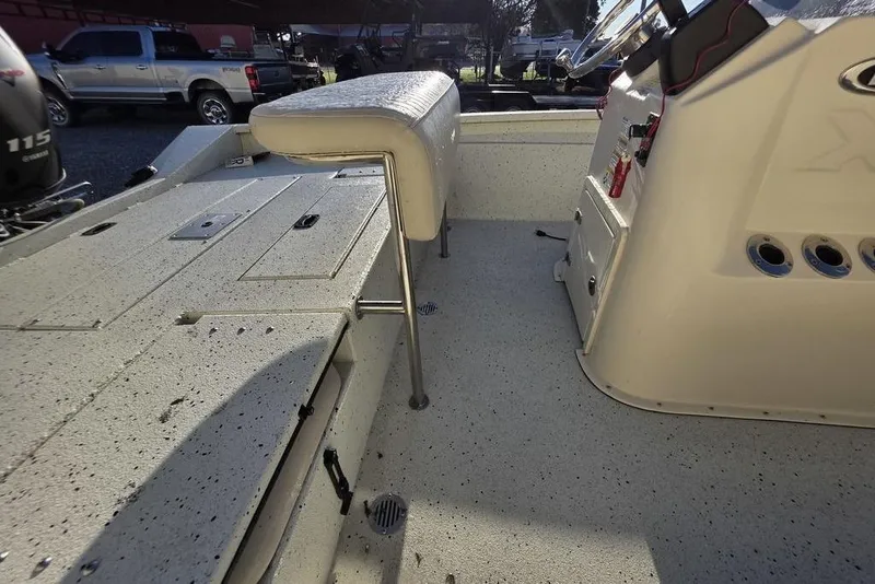 Slide: The Image of 2016 Xpress H20B Bay boat interior with seating and control panel. - 10