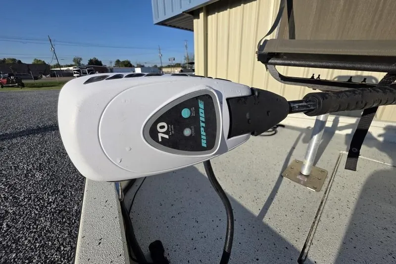 Slide: The Image of 2016 Xpress H20B Bay boat with Riptide trolling motor, close-up view. - 15