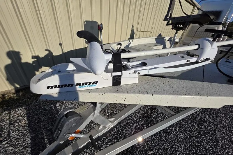 Slide: The Image of 2016 Xpress H20B Bay boat with Minn Kota Riptide trolling motor on trailer. - 18