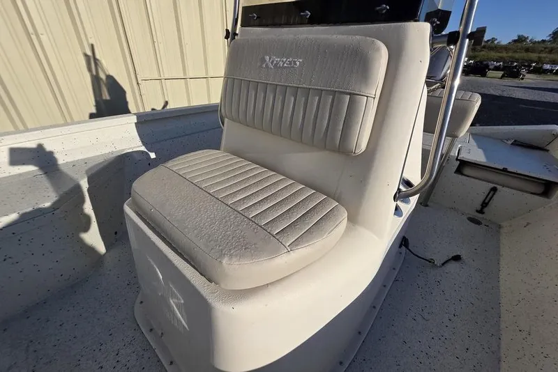 Slide: The Image of 2016 Xpress H20B Bay boat seat with textured upholstery and metal railing. - 21
