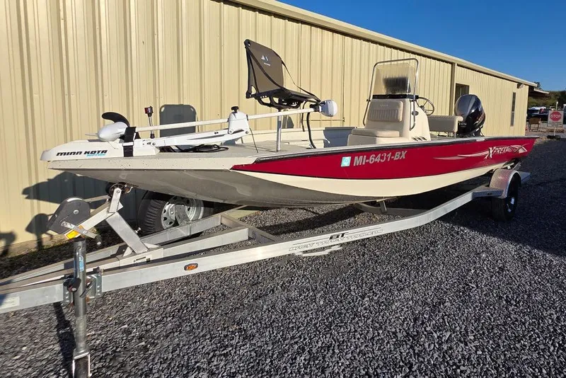 Slide: The Image of 2016 Xpress H20B Bay boat on trailer, featuring Minn Kota trolling motor. - 3