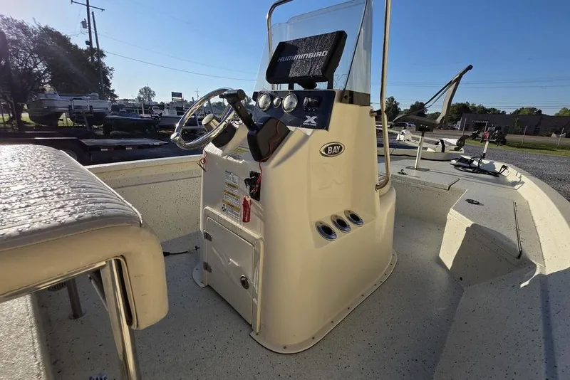 Slide: The Image of 2016 Xpress H20B Bay boat interior with steering console and seating. - 9
