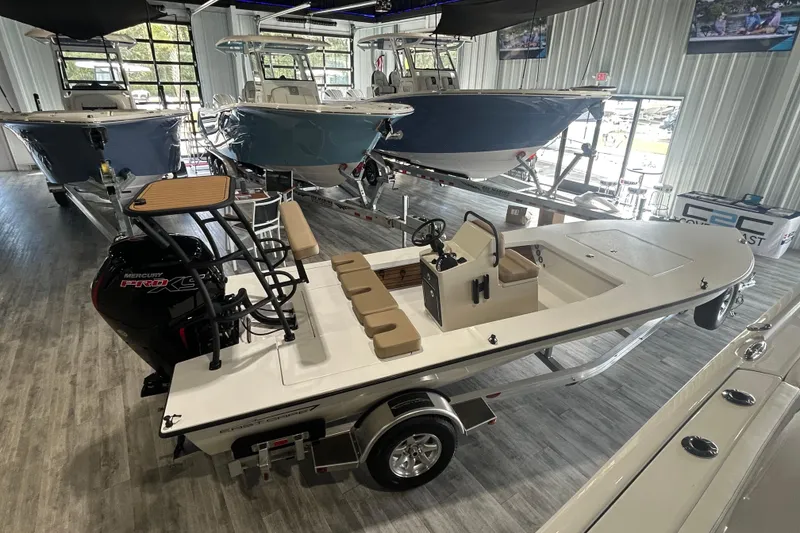 Slide: The Image of 2026 East Cape Vantage boat seat with open storage compartment on deck. - 3